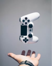 hand holding gaming controller